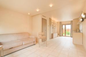 a living room with a couch and a table at Casa Liana Saint-Tropez in Saint-Tropez