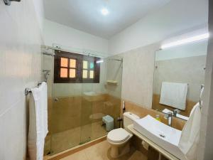 a bathroom with a shower and a toilet and a sink at Signature 3 Bed Villa Clifton Boat Basin in Karachi +17 photos