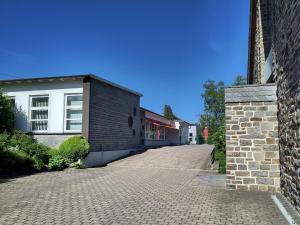 a cobblestone street in front of a building at Herbergskirche Gleidorf in Schmallenberg