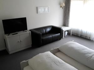 Postel nebo postele na pokoji v ubytování Hotel Kramer