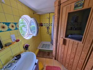 a small bathroom with a sink and a shower at Saat der Hoffnung in Wuppertal