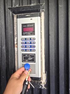 a person holding a pair of scissors and a microwave oven at luxury apartment in Annaba