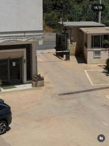 an empty parking lot next to a building at luxury apartment in Annaba