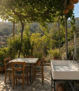a table and chairs sitting on a patio at Eria Moutoullas House in Moutoullas