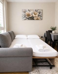a living room with a couch and a table at Sea Horizon in Burgas