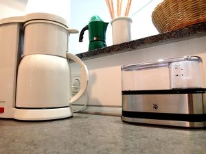 a coffee maker sitting on top of a counter at Hofwiese in Hohenschwangau