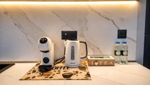 a kitchen counter with an electric appliance on a counter top at Sea Horizon in Burgas