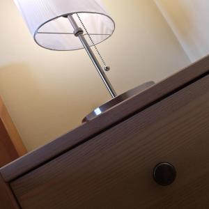 a lamp sitting on top of a wooden door at Hofwiese in Hohenschwangau