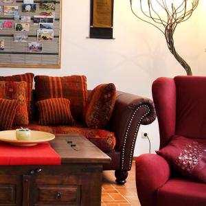 a living room with a couch and a chair at Hofwiese in Hohenschwangau