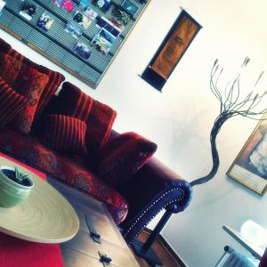 a living room with a chair and a table at Hofwiese in Hohenschwangau
