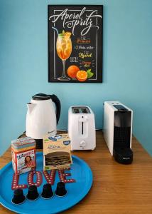 a kitchen counter with a coffee maker and a toaster at Chalet Como Lake - Nature Retreat, foot access only in Griante Cadenabbia