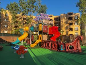 a playground with a slide in a park at 3HB Falésia Garden in Albufeira
