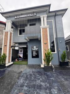 a building with a sign on the front of it at Clisamnoris Hotel limited in Diobu