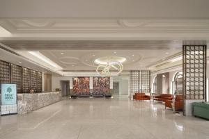 a lobby of a hotel with a chandelier at Treat Imperial Aurangabad City Center in Aurangabad +35 photos