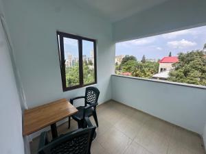a room with a table and chairs and a window at Hotel ARARAT in Gonio
