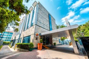 a building in a city with a sky at MGM Mark Whitefield in Bangalore