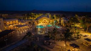 an aerial view of a resort with a pool at night at Shams Alam Beach Resort in Marsa Alam City