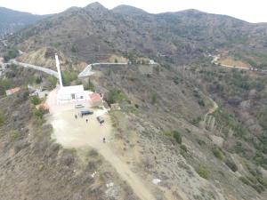 an aerial view of a windmill on a mountain at Christys Palace Hotel in Pedoulas