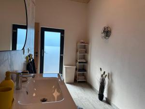 a bathroom with a large sink and a mirror at Blue Moon in Zărneşti +13 photos