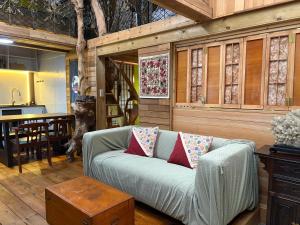 a living room with a couch and a table at A-HOME in Jiufen