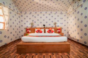 a bedroom with a large bed in a room at Chokhi Dhani Desert Camp in Sām