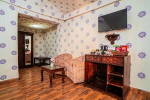 a living room with a couch and a television on a wall at Chokhi Dhani Desert Camp in Sām +92 photos