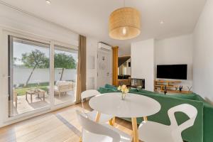 a living room with a couch and a table at Loft luxury Mirador in Cádiz