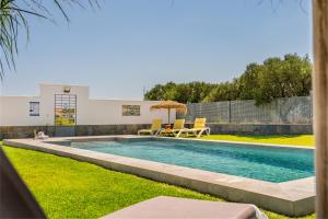 a swimming pool in the backyard of a house at Loft luxury Mirador in Cádiz