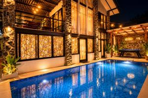 a swimming pool in the middle of a building at Villa W-5 Villa Private Pool Lembang, Bandung in Bandung