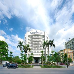 a building with a sign on the top of it at SAILING TOWER Hotel in Khang Qui