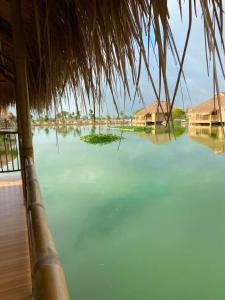 a view of a large body of water with houses at Dung Hoa Resort 