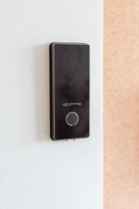 a lightswitch on a wall with the words yokota fire at Hotel Bistrot FINE in Anglet