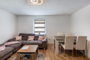 a living room with a couch and a table at Andrea Vacation Home in Döbeln