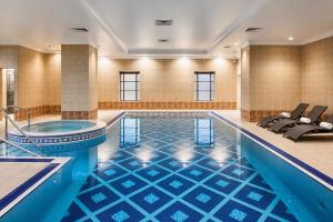 a pool in a hotel room with a swimming pool at Leonardo Hotel Middlesbrough in Middlesbrough
