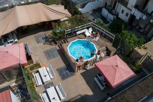 an overhead view of a pool with people sitting around it at WOT Patio Social in Lisbon