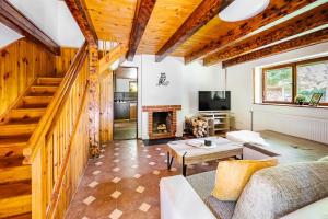 a living room with a couch and a fireplace at Cottage Owl 