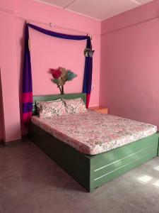 a bedroom with a bed with a vase on it at Luna's Solace-The Rustic Stay-Ease in Guwahati
