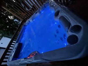 a swimming pool with blue water in it at Memita Mobile homes, Selce in Selce