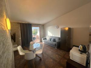 a living room with a couch and a table and chairs at Malibu Ocean View in Adeje