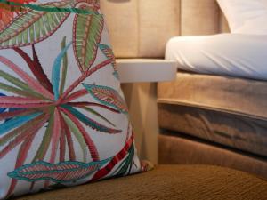 a pillow sitting on the edge of a bed at Spaarnwoude Park Hotel in Velsen-Zuid +13 photos
