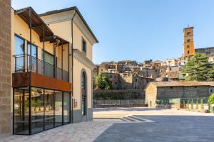 a building with a view of a city at Best Western Plus Carolus Park Hotel in Sutri