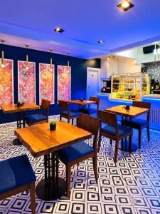 a dining room with wooden tables and chairs at Taksim REXEE Istanbul Istiklal Hotel in Istanbul
