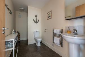 a bathroom with a sink and a toilet at The View, 22 School Park in Kingsbarns +22 photos