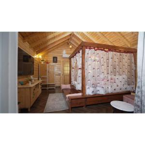 a room with a bedroom with a crib in it at KPHB Wooden Cottages in Hyderabad