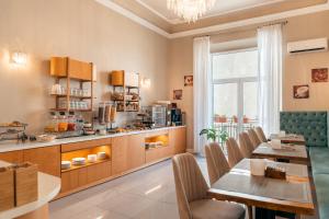 a kitchen and dining room with a table and chairs at Hotel Annabella Roof Terrace in Florence