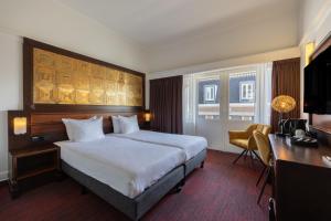 Katil atau katil-katil dalam bilik di Amrâth Hotel DuCasque