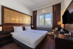 Katil atau katil-katil dalam bilik di Amrâth Hotel DuCasque +19 gambar