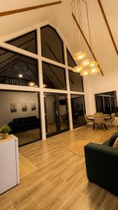 a living room with a couch and a table at Triovista Chalets in Nehoiu +20 photos
