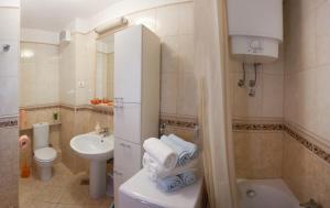 a small bathroom with a toilet and a sink at Residence Apartments Anamaria in Podstrana +30 photos