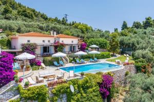 an image of a villa with a swimming pool at Elies Houses in Agnontas